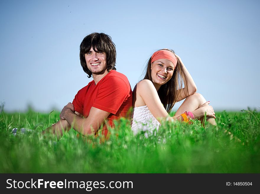 Boy With Long-haired Girl On Grass