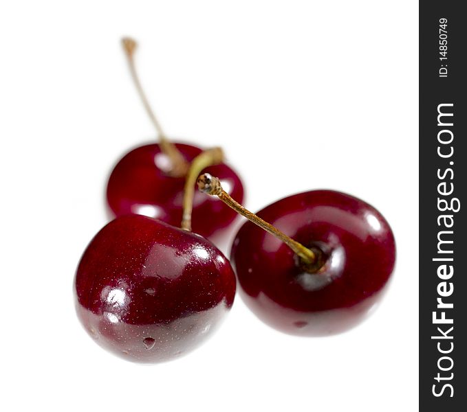 Sweet juicy cherry over white background