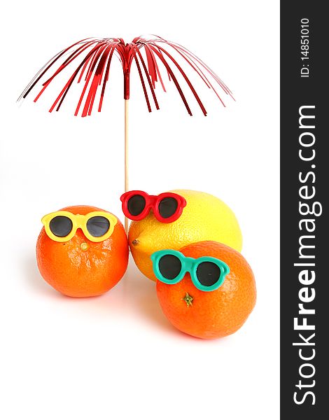 Funny lemon and mandarins in sun glasses on white background