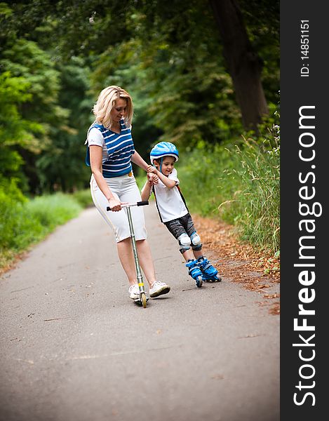 Mother and son playing in the park. Mother and son playing in the park