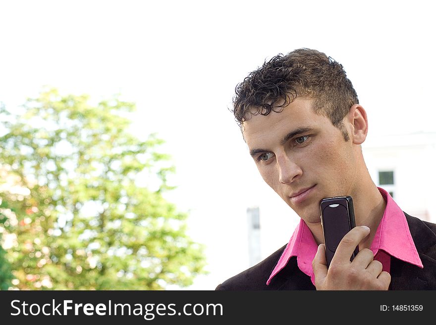 Man on the phone outdoors. Man on the phone outdoors