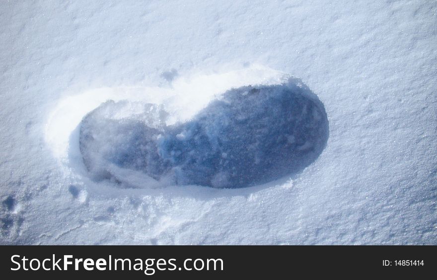 Footprint on the white snow