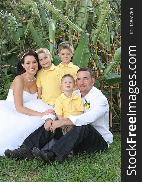 Shot of happy gorgeous bride, husband and children