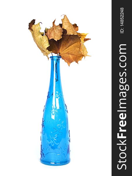 Blue design decorative bottle with wither maple leaves. Blue design decorative bottle with wither maple leaves