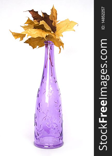 Purple design decorative bottle with wither maple leaves. Purple design decorative bottle with wither maple leaves