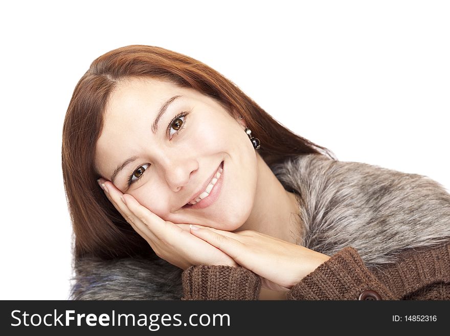 Closeup of a beautiful happy woman leaning with head on palm. Isolated on white background.