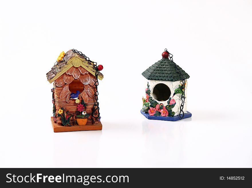 Hanging ceramic bird houses with chaines