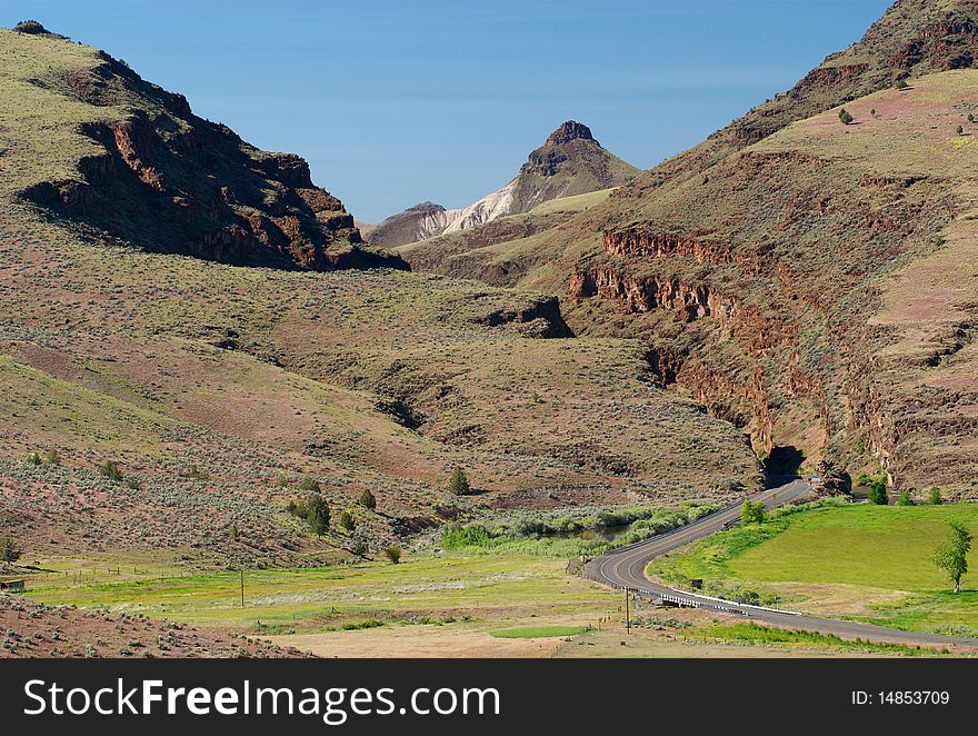 A highway winds into the mountains of eastern Oregon. A highway winds into the mountains of eastern Oregon