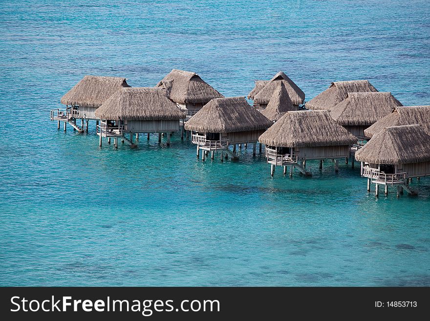 Water bungalows in the turquoise lagoon of Moorea, French Polynesia. Water bungalows in the turquoise lagoon of Moorea, French Polynesia.