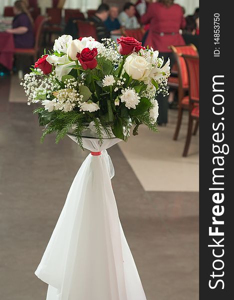 The bouquet of roses decorates a restaurant interior. The bouquet of roses decorates a restaurant interior.