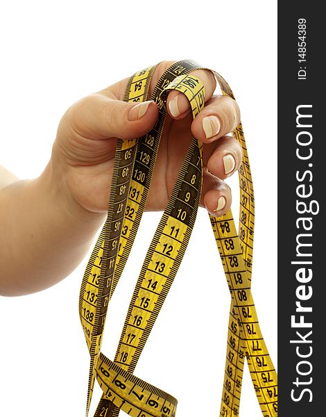 Tape measure in a beautiful female hand isolated on white background