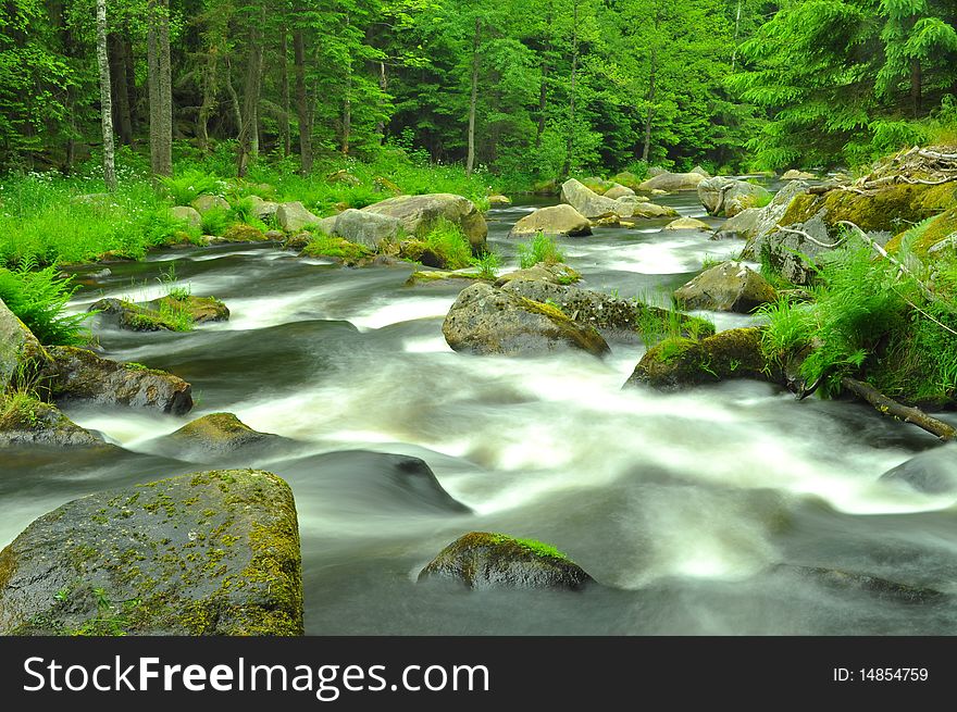 Wild river in mountains valley