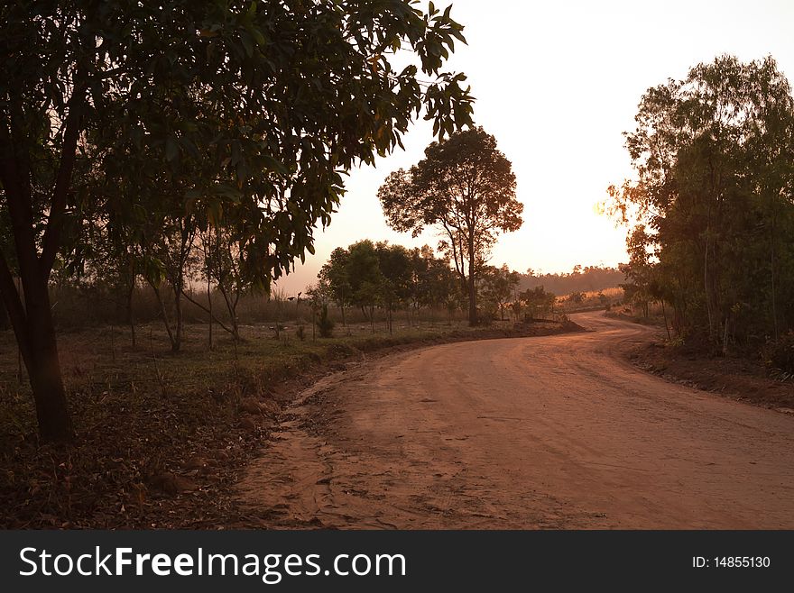 Sunset behind a dirt curvy road which heading to Mo-Hin-Khao, the unseen Thailand. Sunset behind a dirt curvy road which heading to Mo-Hin-Khao, the unseen Thailand