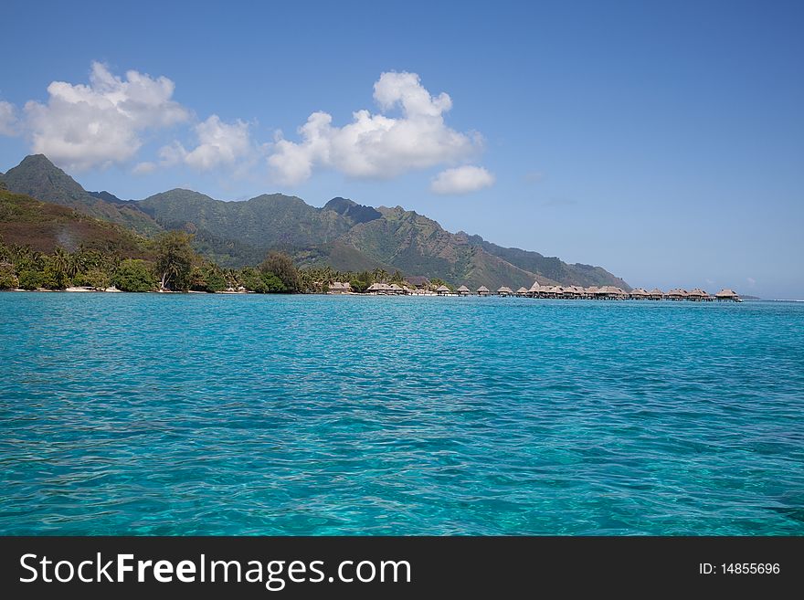 Water bungalows in the turquoise lagoon of Moorea, French Polynesia. Water bungalows in the turquoise lagoon of Moorea, French Polynesia.