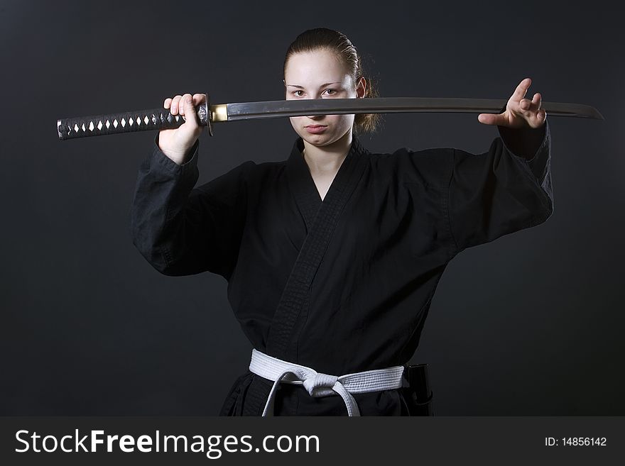 Portrait of female samurai holding katana