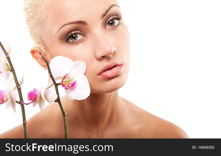 Young beautiful blond woman with white orchid. Young beautiful blond woman with white orchid