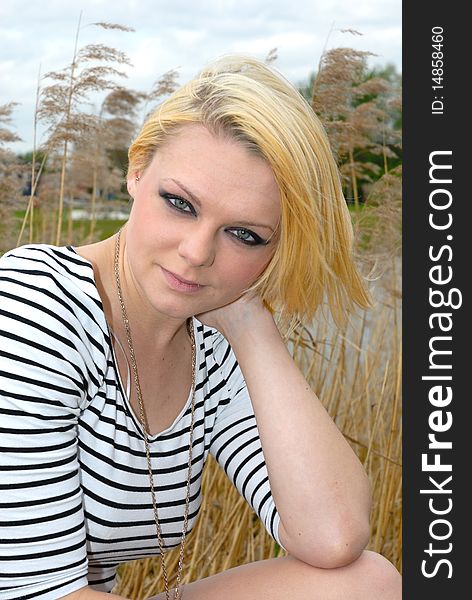 Photograph of pretty blond girl outdoors portrait. Photograph of pretty blond girl outdoors portrait