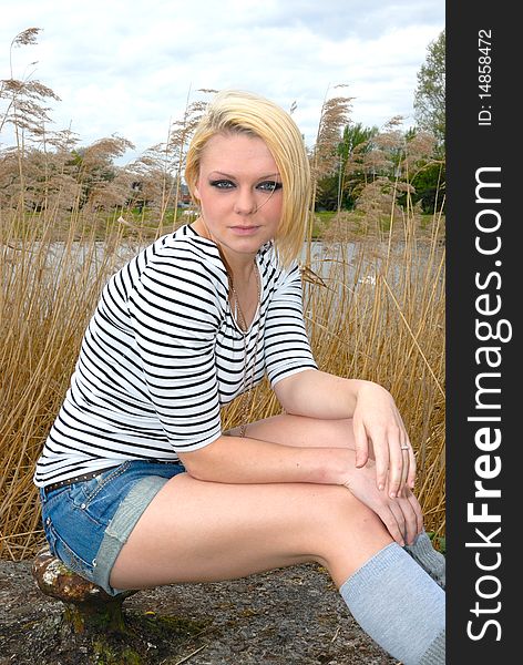 Photograph of pretty blond girl outdoors portrait