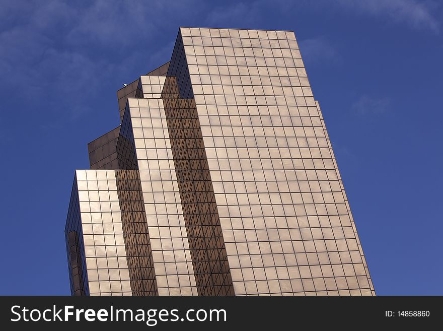 Looking up at a copper colored modern office building. Horizontal shot. Looking up at a copper colored modern office building. Horizontal shot.