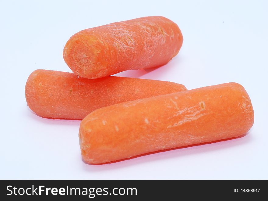 A couple of orange baby carrots.