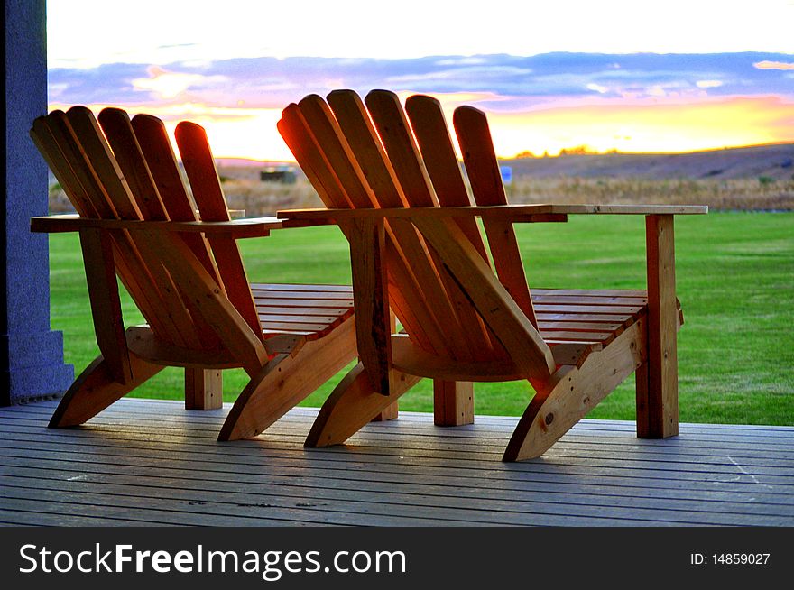 Two Wood Chairs At Sunset
