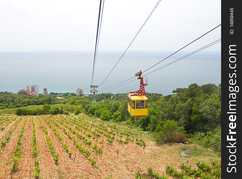 Rope-way with tram from mountain to sea