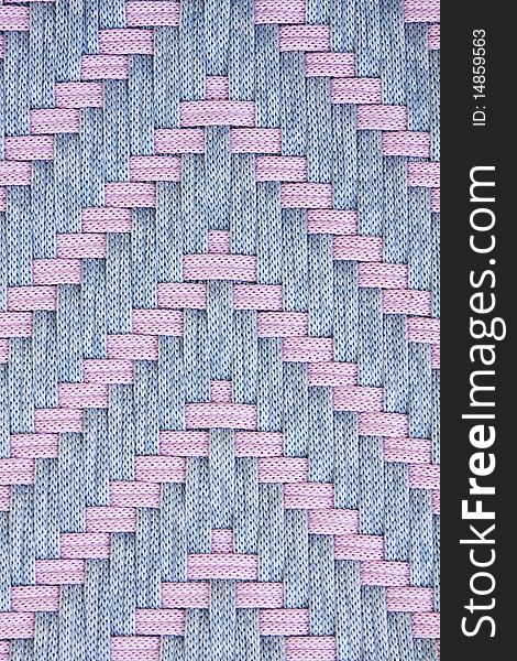 Pink and grey fabric strands in arrow weave pattern