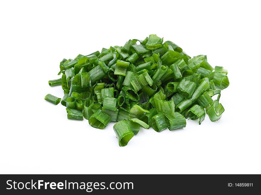 Green spring onions cutting on white