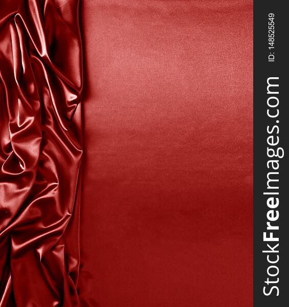 Smooth elegant red silk or satin texture can use as abstract background. Luxurious background design