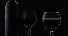 Rose Wine. Red Wine In Wine Glass Over Black Background. Silhouette Stock Photos