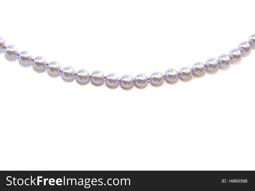 Necklace with pearls isolated on white background.