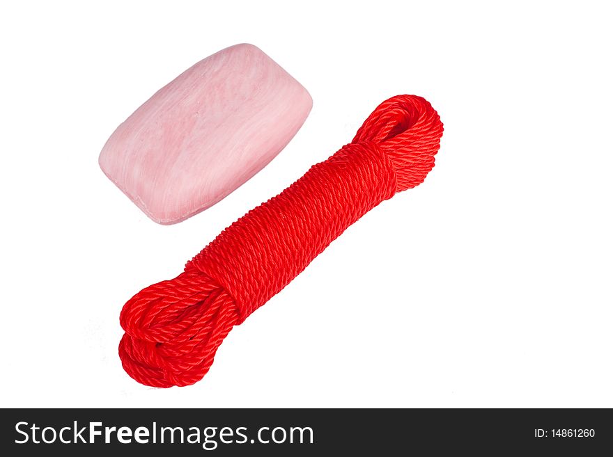 Red rope in hank and soap isolated on white. Red rope in hank and soap isolated on white