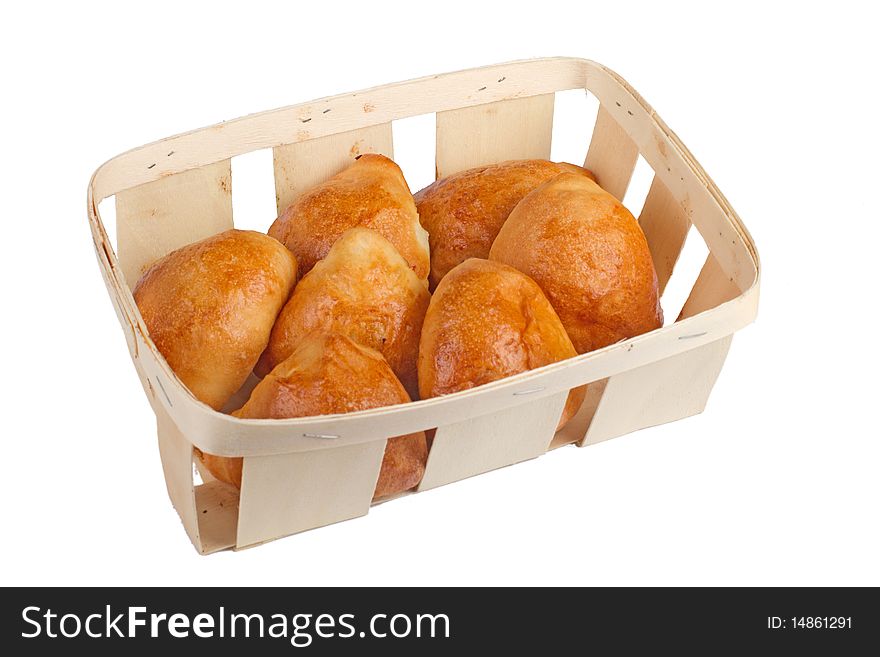Pirogies pasties in basket, isolated on white