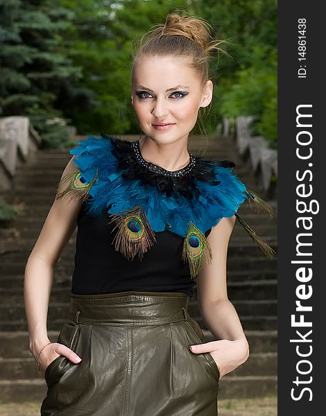 Girl In Blouse With Peacock Feathers Posing