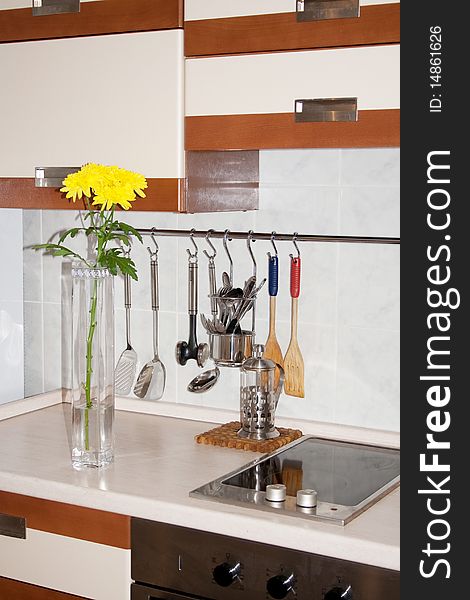 Vase With Yellow Chrysanthemums On Kitchen