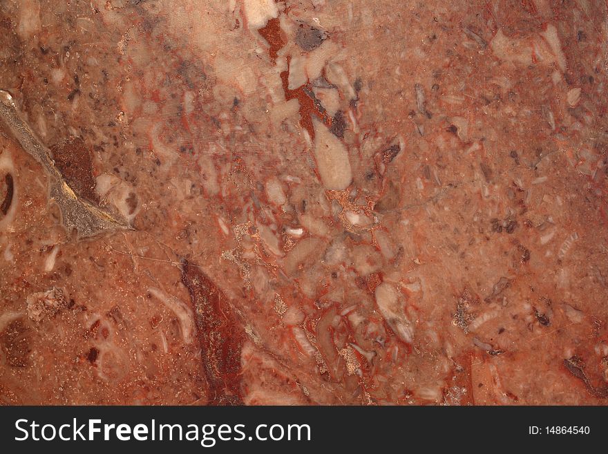 A close up of a red rock texture