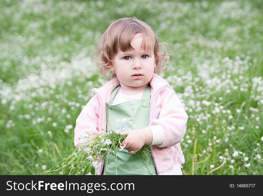 Little Beautiful Girl With Bunch Of Flowers