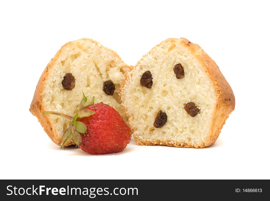 A fresh-baked muffin with raisins and strawberry isolated on a white background