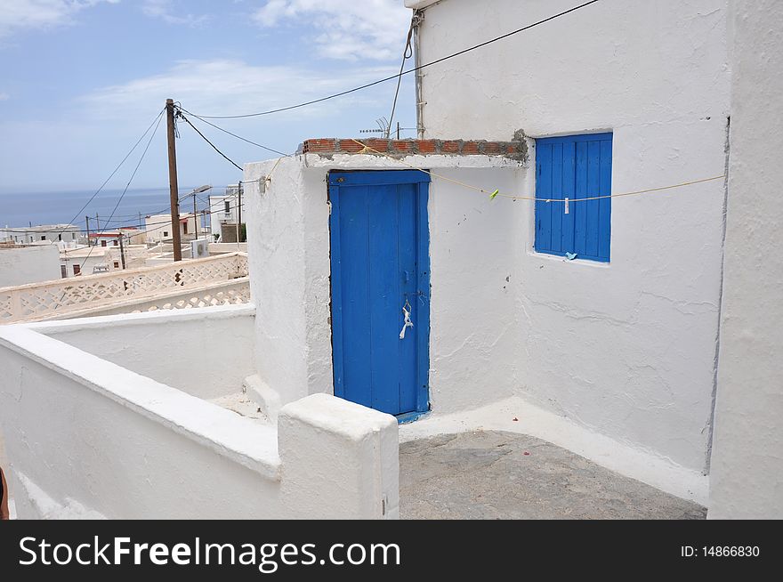 Simple and typical white and blue greek house