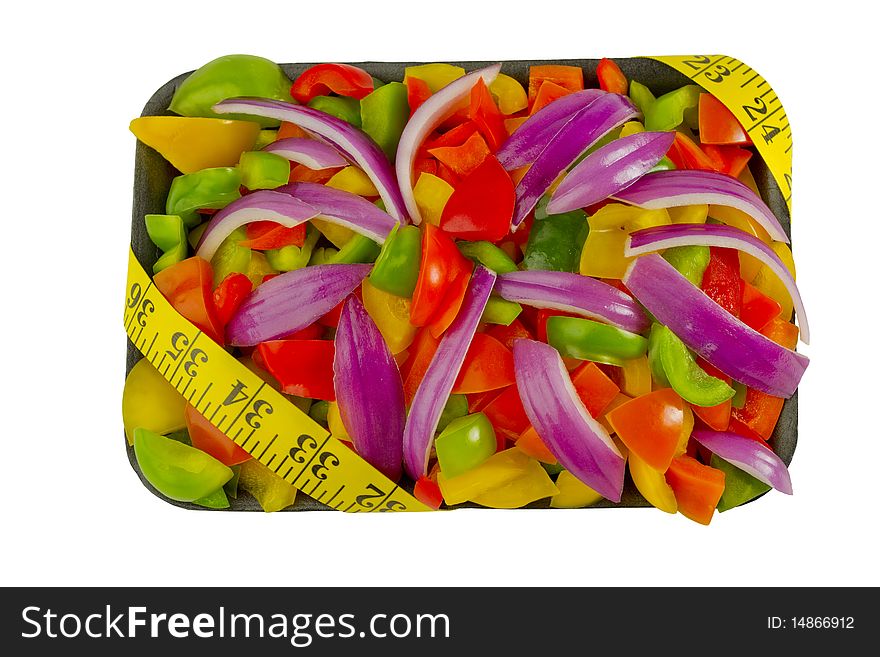 Cut vegetables with measuring tape on white background with clipping path. Cut vegetables with measuring tape on white background with clipping path