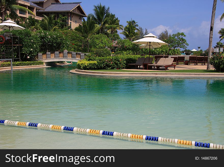 Beautiful swimming pool with bridge on it at the hotel