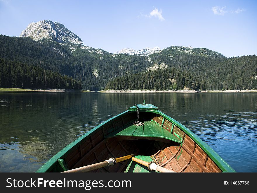 Beautiful natural landscape with wooden boat on lake. Beautiful natural landscape with wooden boat on lake