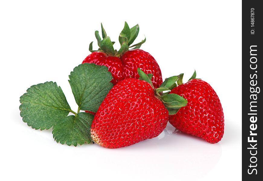 Three bright red strawberries with leaves. Three bright red strawberries with leaves