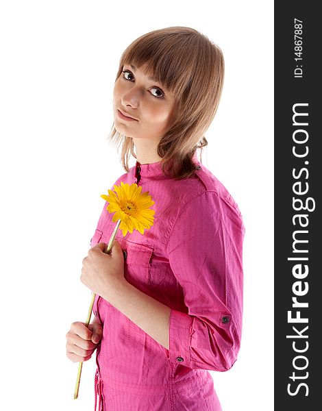 Portrait of the beautiful girl with yellow gerbera