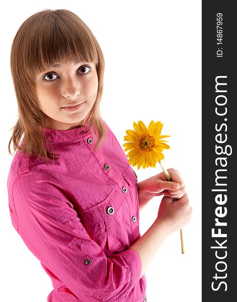 Portrait of the beautiful girl with yellow gerbera