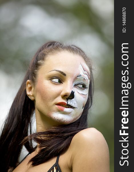 Girl with tigress make up close up portrait. Girl with tigress make up close up portrait