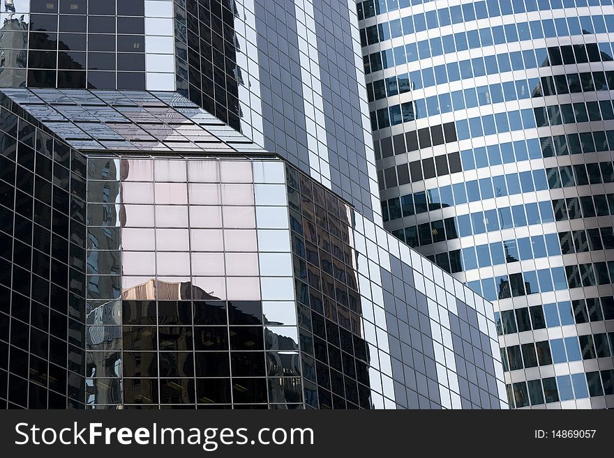 The window reflections of buildings in a city. The window reflections of buildings in a city