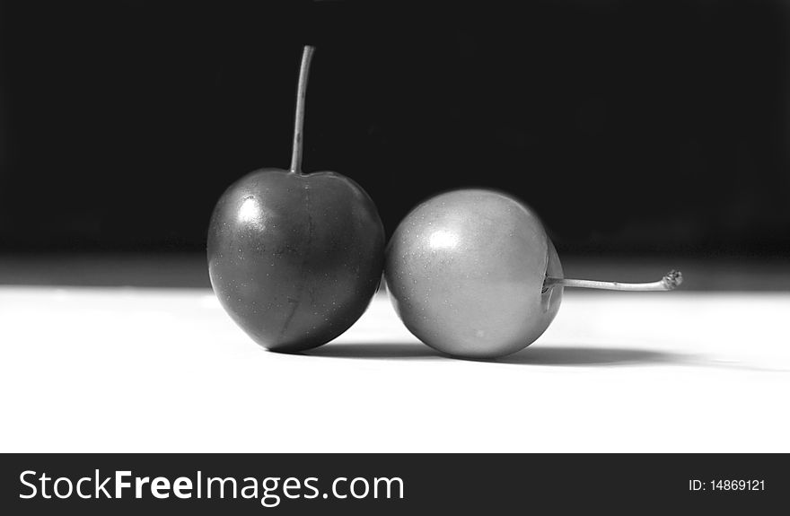 ripe juicy delicious round berries of cherry on a black background. ripe juicy delicious round berries of cherry on a black background