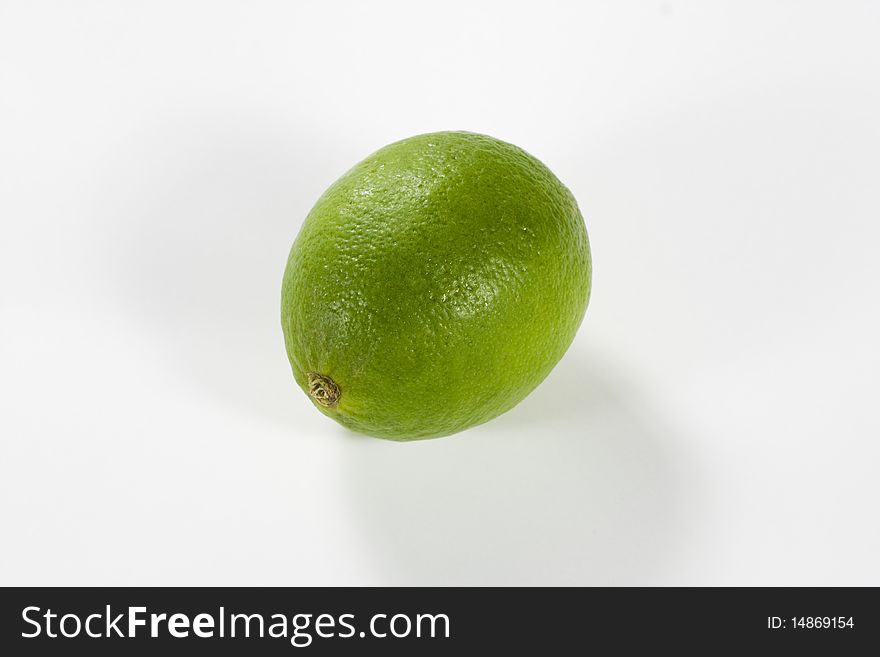 A green Lime cutout against white