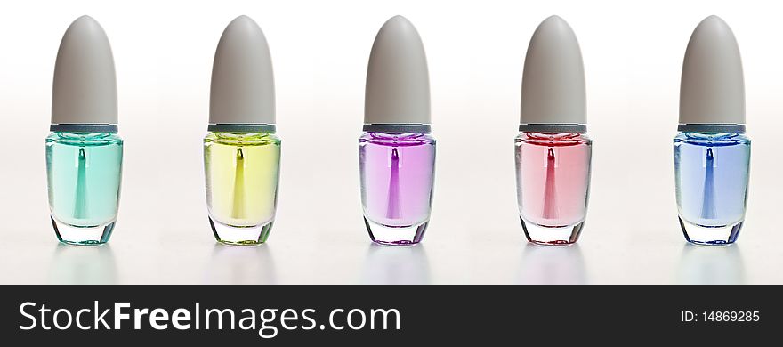 Small cosmetic bottles in diferent colors. Small cosmetic bottles in diferent colors